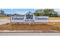 Colonial Charters Golf Club entrance sign with well-maintained landscaping at 309 Lake Mist Ct. # 309, Longs, SC 29568