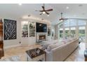 Cozy living room features built-in shelving, a fireplace, and large windows at 3100 Lahinch Dr., Myrtle Beach, SC 29579
