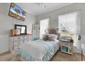 Cozy bedroom with carpeted floors, white furniture, a television, and sheer curtains for natural light at 3600 White Wing Circle, Myrtle Beach, SC 29579