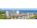 An aerial view of the condominium complex with partial ocean views at 5601 N Ocean Blvd. # E-111, Myrtle Beach, SC 29577