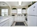 Bright kitchen with white cabinets, modern appliances, and lots of counter space at 5750 Oyster Catcher Dr. # 1034, North Myrtle Beach, SC 29582