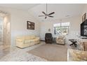 Cozy living room with vaulted ceiling, neutral paint, ceiling fan and comfortable seating at 799 Mount Gilead Place Dr., Murrells Inlet, SC 29576