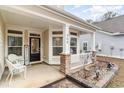 Inviting front porch with decorative elements and a 'Welcome' sign, perfect for relaxing and enjoying the outdoors at 808 Kingfisher Dr., Myrtle Beach, SC 29577