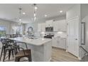 Bright and airy kitchen with a spacious island, pendant lighting, and stainless steel appliances at 1275 Winding Creek Way, Myrtle Beach, SC 29588