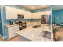 Well-equipped kitchen featuring granite countertops, stainless steel appliances, and modern cabinetry at 184 Carolina Lakes Blvd., Myrtle Beach, SC 29588