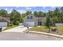 Attractive two-story home with a neat lawn, driveway, and a two-car attached garage at 197 Black Bear Rd., Myrtle Beach, SC 29588