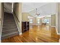 Bright, open living space with high ceilings, hardwood floors, and staircase to the left at 197 Black Bear Rd., Myrtle Beach, SC 29588