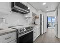 Modern kitchen features stainless steel appliances, granite countertops and ocean view at 2300 N Ocean Blvd. # 1037, Myrtle Beach, SC 29577