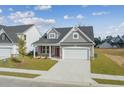 Attractive home with a two-car garage, well-manicured lawn, and pleasing architectural details at 2416 Campton Loop, Conway, SC 29527