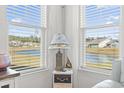 Window view of neighborhood pond with serene landscape at 2476 Blue Crane Circle # 101, Myrtle Beach, SC 29577