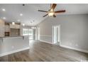 Spacious living room with vaulted ceiling, a ceiling fan, and wood-look flooring offers a contemporary design at 2588 Cottonwood Dr., Loris, SC 29569