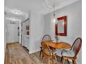 Cozy dining area featuring a wood table, stylish light fixture, and easy access to laundry area at 3557 Chestnut Dr. # 3557, Myrtle Beach, SC 29588