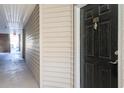 Entrance to the building with a door marked '1013', illuminated by natural light at 3762 Citation Way # 1013, Myrtle Beach, SC 29577