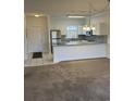 Open kitchen with granite countertops, stainless steel appliances, white cabinetry, and tiled backsplash at 4155 Hibiscus Dr. # 103, Little River, SC 29566