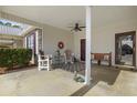 Inviting covered porch with comfortable seating and a ceiling fan at 437 Colonial Trace Dr. # 2C, Longs, SC 29568