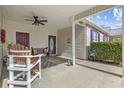 Inviting front porch featuring comfortable seating and outdoor decor at 437 Colonial Trace Dr. # 2C, Longs, SC 29568