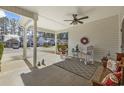 Cozy covered porch with outdoor seating and view of the neighborhood at 437 Colonial Trace Dr. # 2C, Longs, SC 29568