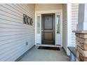 Close-up of the front door featuring sidelights, stylish hardware, and a welcoming entrance at 568 Canborough Lane, Murrells Inlet, SC 29576