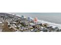 Aerial view showcases property location along beach with nearby town and residential area at 900 N Waccamaw Dr. # 303, Murrells Inlet, SC 29576