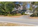 Attractive single-story home with a well-maintained yard and ample parking on a quiet street at 172 Hawthorn Dr., Pawleys Island, SC 29585