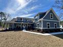 Inviting two-story home featuring a classic design, dormer windows, and a well-maintained front yard at 2076 Fawn Run, Conway, SC 29526