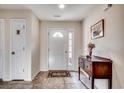 Inviting foyer featuring neutral walls, tiled floor, and console table at 305 Aqua Vista Ct., Myrtle Beach, SC 29588