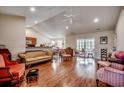 Open living room showcasing hardwood floors, high ceilings, and slider doors at 305 Aqua Vista Ct., Myrtle Beach, SC 29588