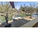 View of the backyard featuring a private dock and waterfront access, perfect for enjoying water activities at 3615 Sunfish St., Murrells Inlet, SC 29576