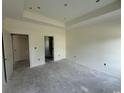 A spacious bedroom with neutral walls, base trim and multiple doorways at 6049 Hodges Rd., Conway, SC 29527
