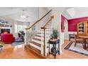 Inviting foyer with wood floors and staircase leading to the living room at 710 Cedar Dr. S, Surfside Beach, SC 29575