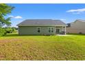 This large backyard features a patio and ample lawn space, ideal for relaxation and outdoor entertaining at 825 Payne Ct., Conway, SC 29526