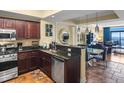 Open kitchen with stainless steel appliances, granite counters, and adjacent dining area with ocean views at 100 North Beach Blvd. # 1917, North Myrtle Beach, SC 29582