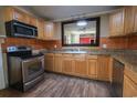 Kitchen with stainless steel appliances and wooden cabinets at 1841 Jasper St., Georgetown, SC 29440