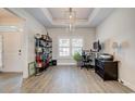 Bright home office with large windows, built in shelves and a modern desk at 221 Portrush Loop, Pawleys Island, SC 29585