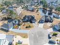 Aerial view of a neighborhood with a lake, showcasing this home's proximity to community amenities at 227 Old Hickory Dr., Conway, SC 29526