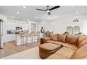 Open-concept living space with a kitchen island, leather sofa, and dining area at 2602 Blue Crane Circle # 104, Myrtle Beach, SC 29577