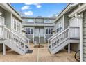 Inviting entrance to condo units showcasing stairs leading to the front doors at 311 Cumberland Terrace Dr. # 7-E, Myrtle Beach, SC 29572