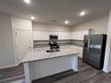 Modern kitchen featuring granite countertops, stainless steel appliances, and ample cabinet space at 531 Tillage Ct., Conway, SC 29526