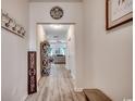 Inviting hallway featuring wood-look flooring leading to a bright and airy living space at 325 High Falls Dr., Conway, SC 29526