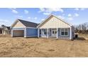 Charming single-story home with blue siding, white trim, and a two-car garage on a spacious lot at 3372 Gurley Rd., Loris, SC 29569