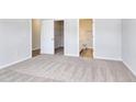 Spacious main bedroom featuring neutral carpeting, ensuite bathroom and a walk-in closet at 491 Wagner Cir., Conway, SC 29526