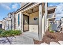 View of the front entrance featuring a charming stucco wall and decorative blue fish accent at 610 15Th Ave. S # 1, Surfside Beach, SC 29575