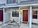 Condo entrance with a red door, window, and a small, fenced front area at 801 Burcale Rd. # G-5, Myrtle Beach, SC 29579