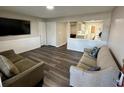 Open-concept living room with wood-look floors and modern gray and white decor at 801 Burcale Rd. # G-5, Myrtle Beach, SC 29579