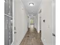 Bright hallway with ceramic tile, leading to living areas, and featuring stylish lighting fixtures at 1108 Inlet View Dr., North Myrtle Beach, SC 29582