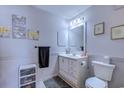 Bathroom featuring white vanity, framed mirror, decorative accents and coordinated wall art at 223 Maisons Dr. # A8, Myrtle Beach, SC 29572