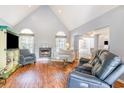 Cozy living room features a fireplace and vaulted ceilings at 354 Deer Run Ave., Georgetown, SC 29440