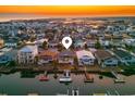 An aerial view shows the proximity of this house to the water and the neighborhood surrounding the property at 40 Fairmont St., Ocean Isle Beach, NC 28469