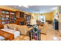 Spacious living room features hardwood floors, comfortable seating, and built-in shelving and cabinetry at 4244 Luck Ave., Little River, SC 29566