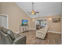 Comfortable living room with ceiling fan, neutral walls, and hardwood flooring at 87 Lake Trail, Pawleys Island, SC 29585